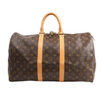 Louis Vuitton Monogram Canvas Keepall 45 Travel Bag M41428 featuring brown LV monogram canvas, tan leather handles and trim, gold-tone hardware, and zip closure with padlock, displayed on a white background.