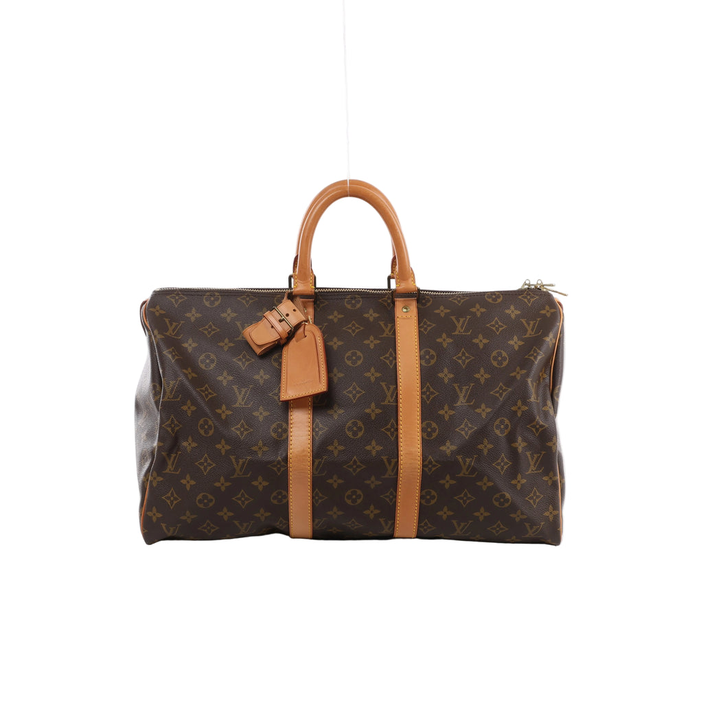 Brown Louis Vuitton Keepall 45 Monogram canvas travel bag with tan leather handles and trim, luggage tag and gold-tone zip hardware.