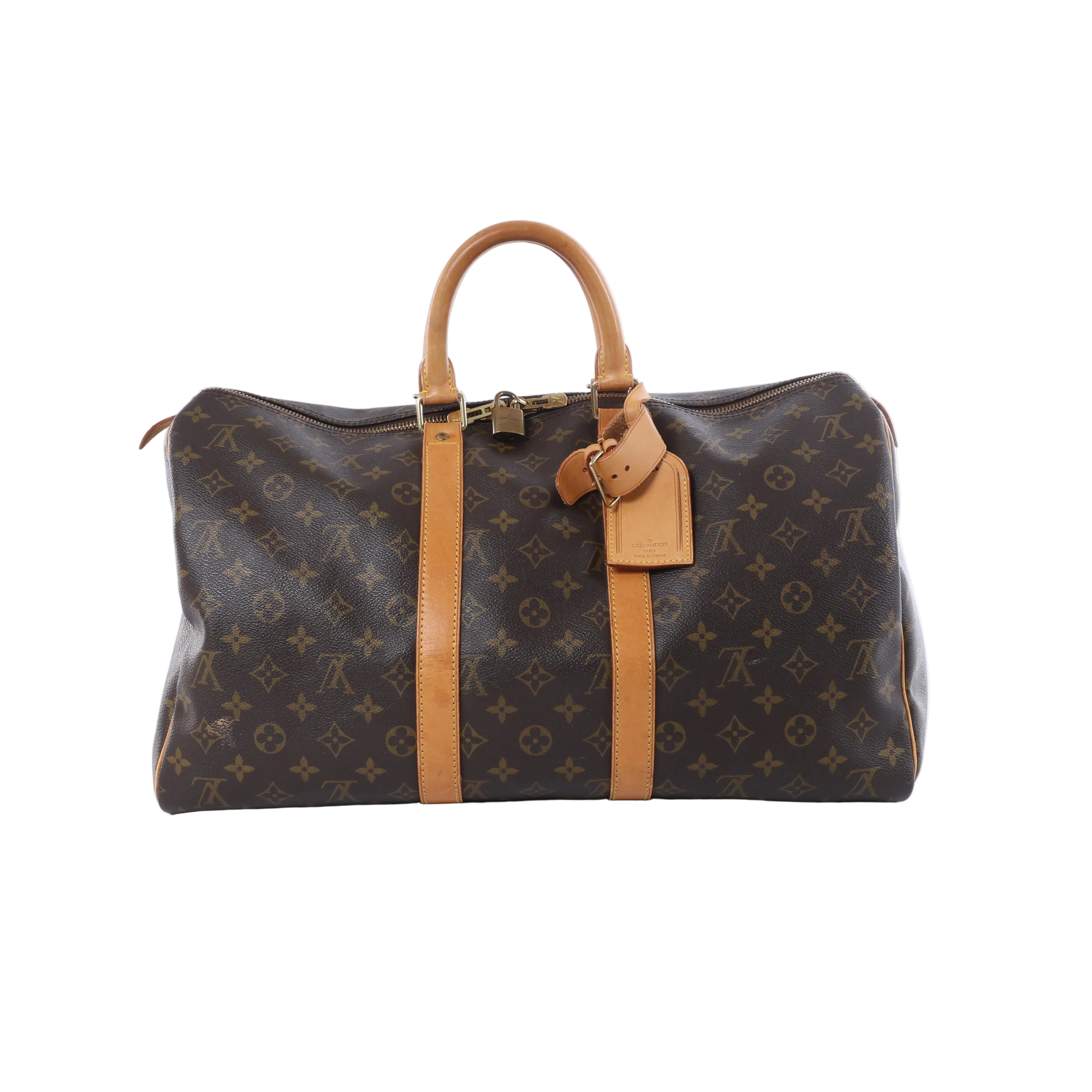 Brown Louis Vuitton Monogram Keepall 45 travel bag with tan leather handles, trim and luggage tag on a white background.