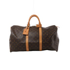 Brown Louis Vuitton Keepall 50 Monogram canvas travel bag with tan leather top handles, vertical trim, luggage tag and gold-tone zip hardware.