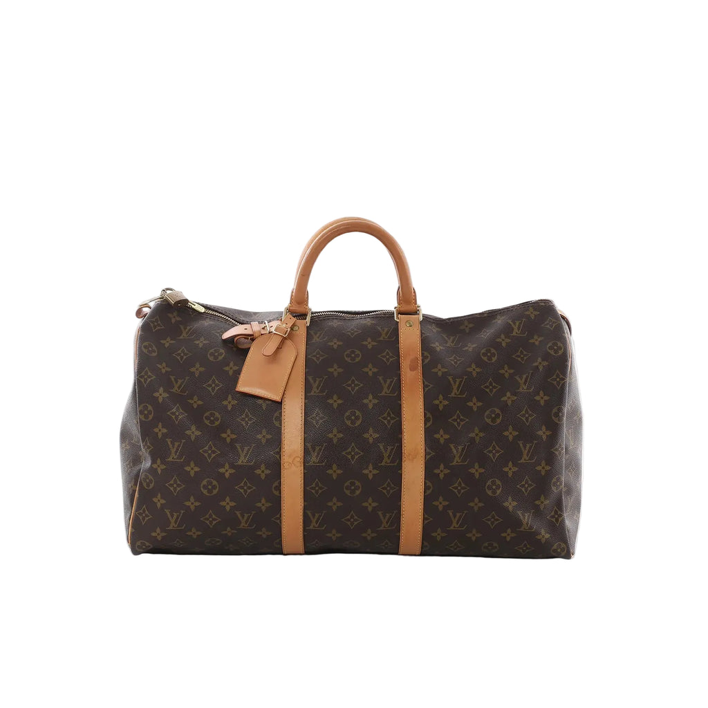 Louis Vuitton Keepall 50 Monogram canvas travel bag with tan leather handles and straps, top zip closure and padlock, front view on a white background.