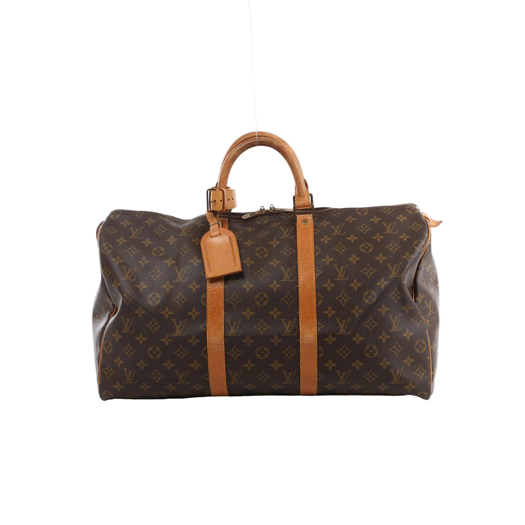 Brown Louis Vuitton Keepall 50 Monogram canvas travel bag with tan leather top handles, vertical trim, luggage tag and gold-tone zip hardware.