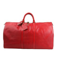 Louis Vuitton Keepall 55 travel bag in bold red Epi leather with top handles, gold-tone hardware, luggage tag, and lock detail. Spacious and structured.