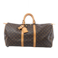 Front view of a brown Louis Vuitton Keepall 55 Monogram canvas travel bag with tan leather trim, rolled handles, luggage tag and padlock on a white background.