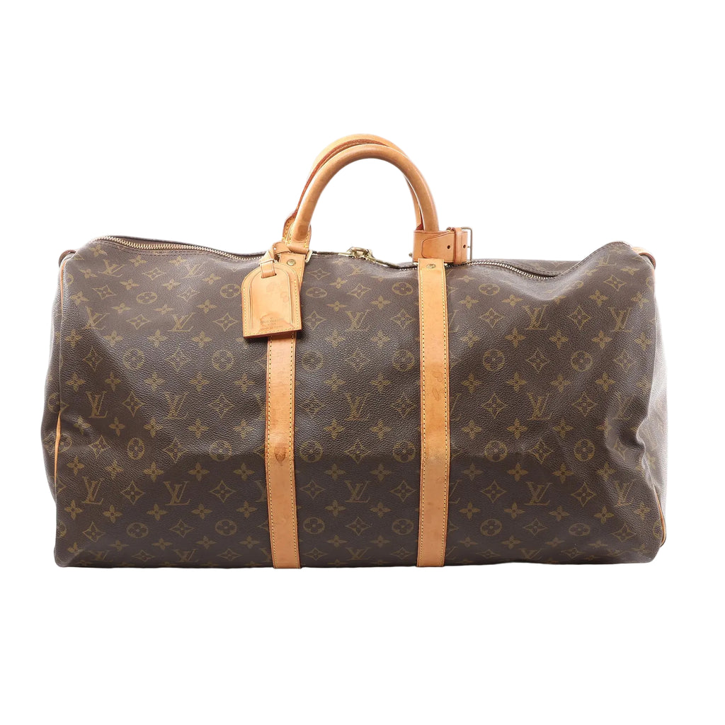 Louis Vuitton Keepall 55 duffle in brown Monogram canvas with tan leather trim, top handles, luggage tag, and zip closure, front view on white background.