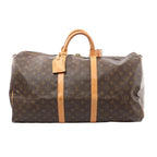 Louis Vuitton Keepall 55 duffle in brown Monogram canvas with tan leather trim, top handles, luggage tag, and zip closure, front view on white background.