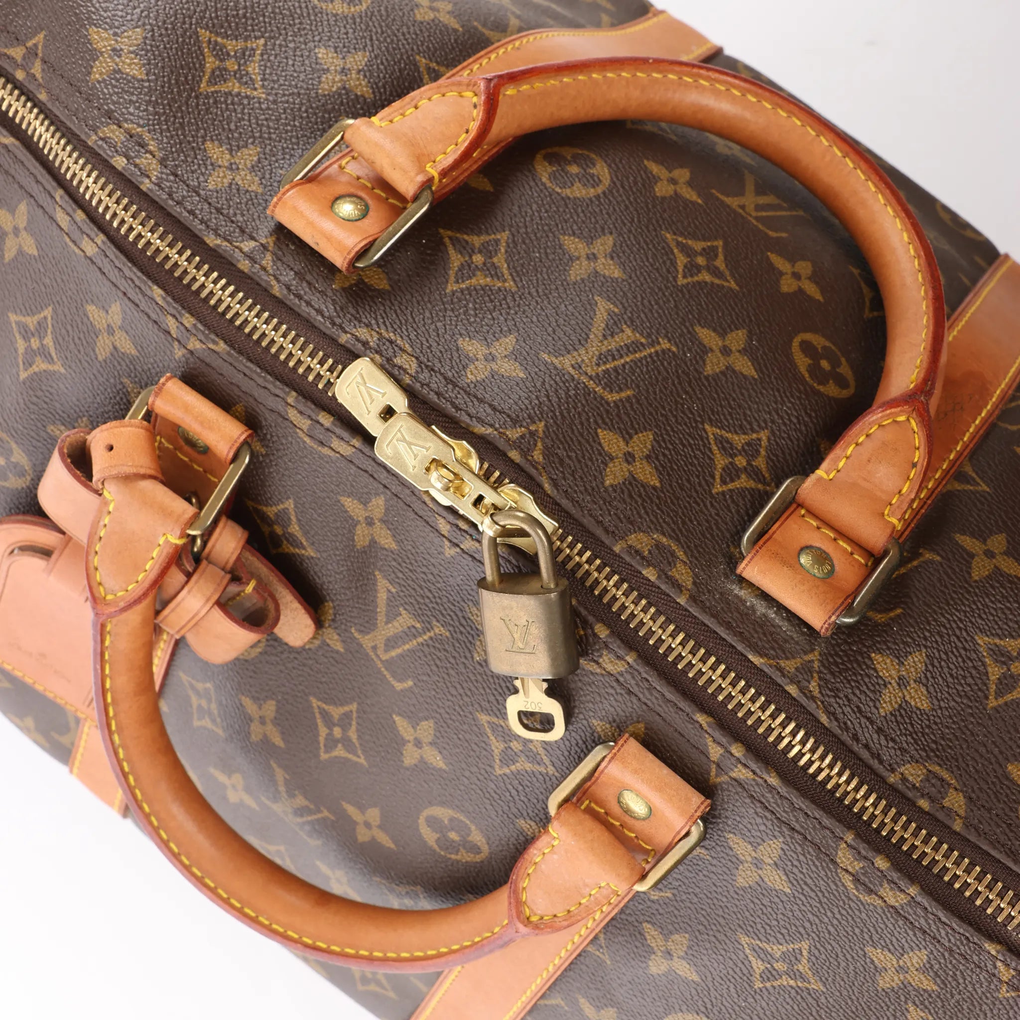 Louis Vuitton Keepall 55 Monogram Canvas Travel Bag in Brown