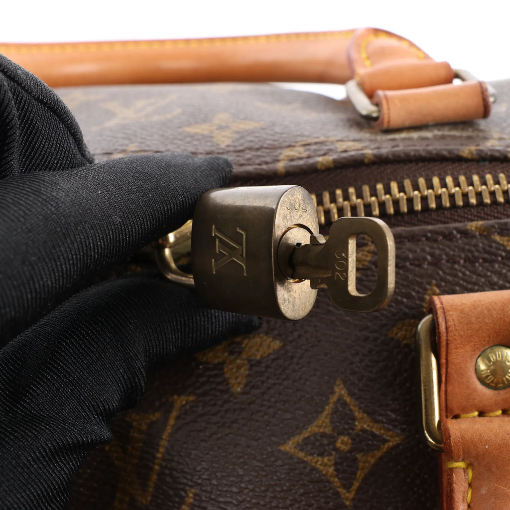 Louis Vuitton Keepall 55 Monogram Canvas Travel Bag in Brown