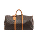 Louis Vuitton Keepall 55 duffle in brown Monogram canvas with tan vachetta leather trim, top handles, luggage tag, and zip-top closure, front view on white background.