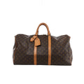 Brown Louis Vuitton Keepall 55 Monogram canvas travel bag with tan leather top handles, vertical trim, luggage tag and gold-tone zip hardware.