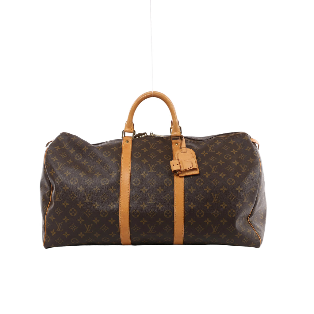 Brown Louis Vuitton Keepall 55 Monogram canvas travel bag with tan leather top handles, vertical trim, luggage tag and gold-tone zip hardware.