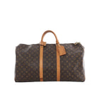 Louis Vuitton Keepall 55 travel bag in brown Monogram canvas with tan leather top handles, two vertical leather straps, zip top and hanging luggage tag.