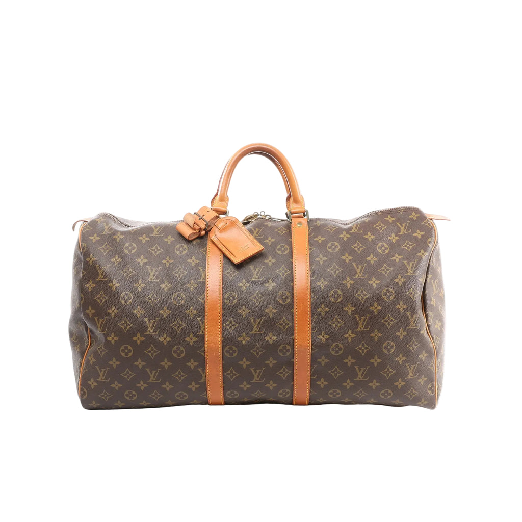 Louis Vuitton Keepall 55 brown Monogram canvas travel duffle with tan leather trim, double top handles, zip-top closure, and luggage tag, front view on white background.