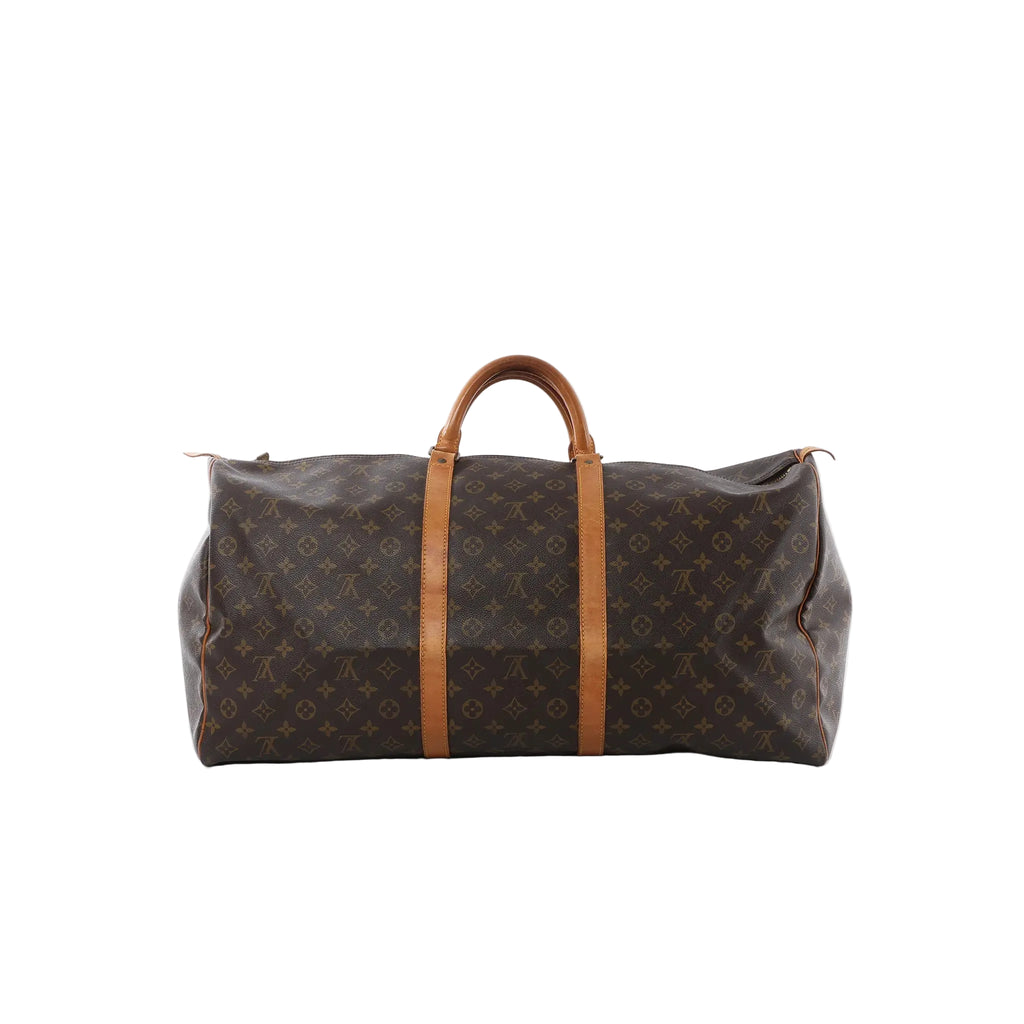 Louis Vuitton Keepall 60 Monogram canvas travel bag with vachetta leather top handles and trim on white background.