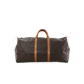 Louis Vuitton Keepall 60 Monogram canvas travel bag with vachetta leather top handles and trim on white background.
