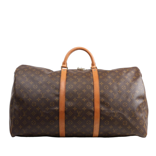 Louis Vuitton Monogram Canvas Keepall 60 Travel Bag M41422 featuring brown LV monogram canvas, tan leather handles and trim, gold-tone hardware, and zip closure, displayed on a white background.
