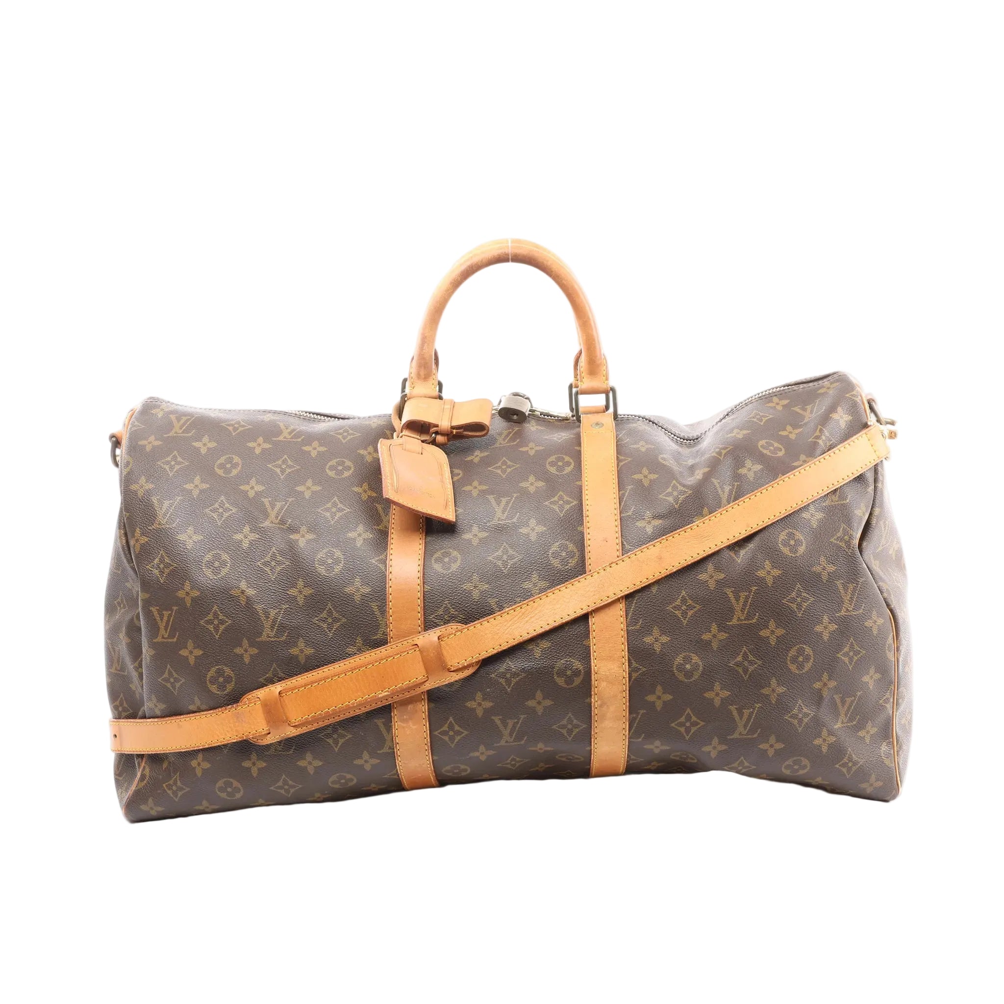 Louis Vuitton Keepall Bandoulière 55 brown monogram canvas travel bag with tan leather handles, trim, and detachable shoulder strap, front view on white background.