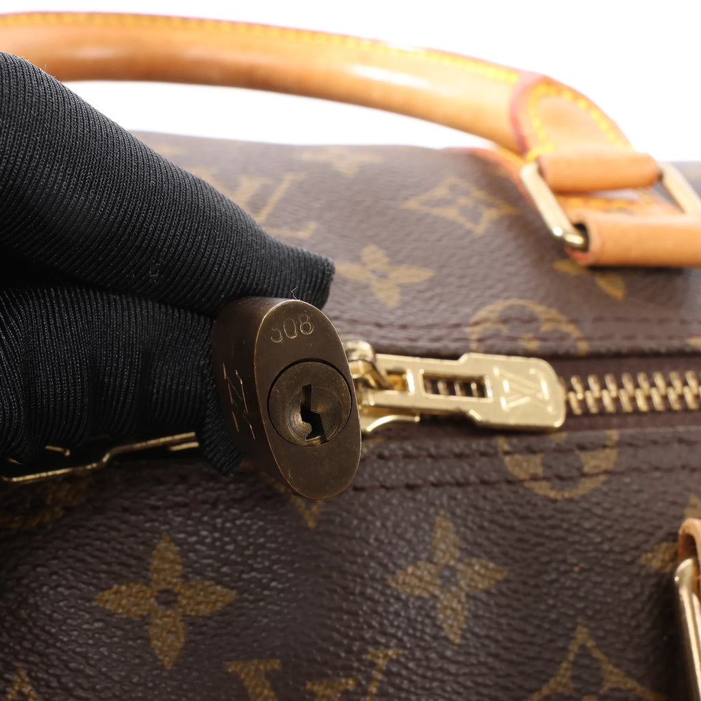 Louis Vuitton Keepall Bandoulière 55 Monogram Canvas Travel Bag in Brown M41414