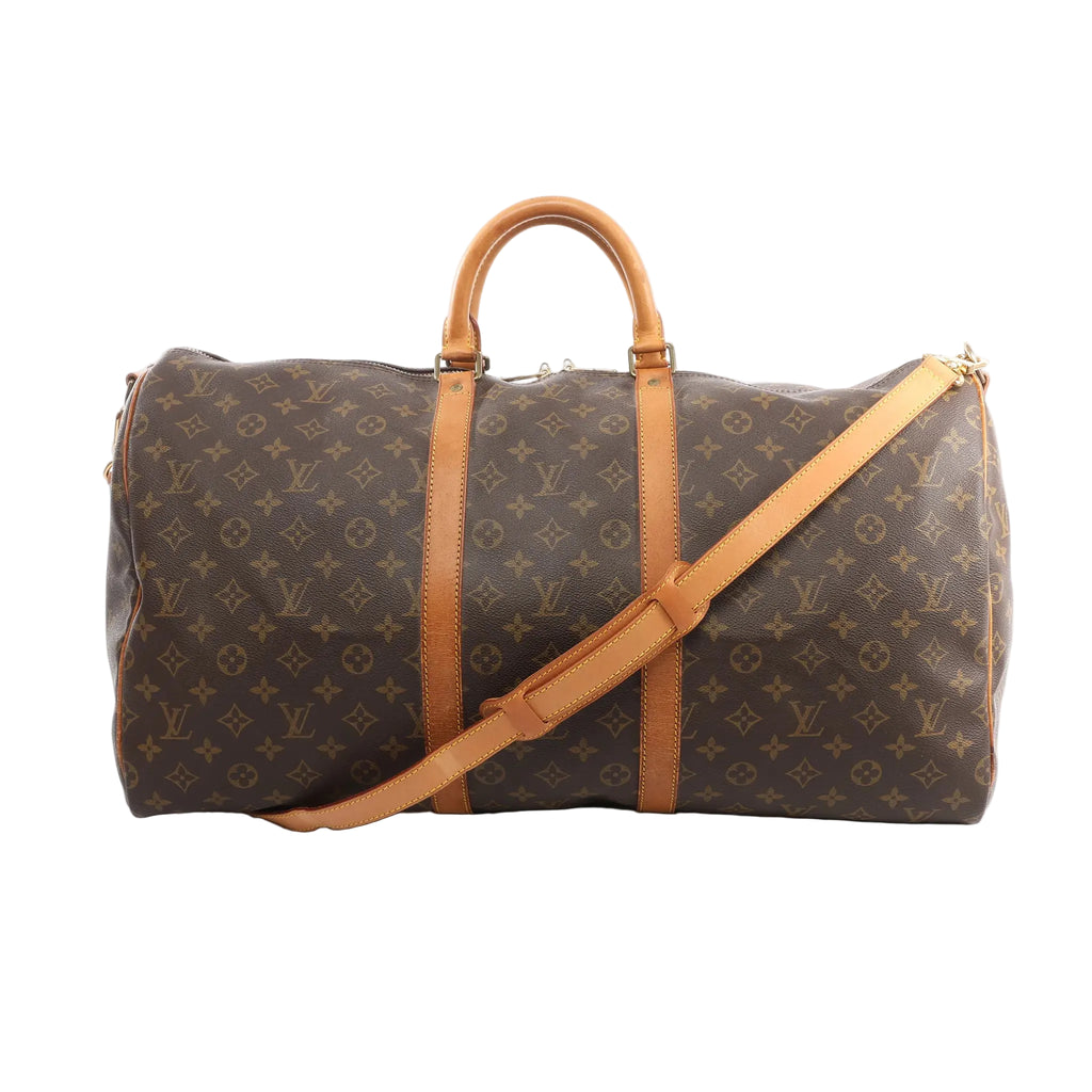 Louis Vuitton Keepall Bandoulière 55 travel bag in brown Monogram coated canvas with natural cowhide leather trim, dual top handles, removable shoulder strap, and gold-tone hardware on a white background.