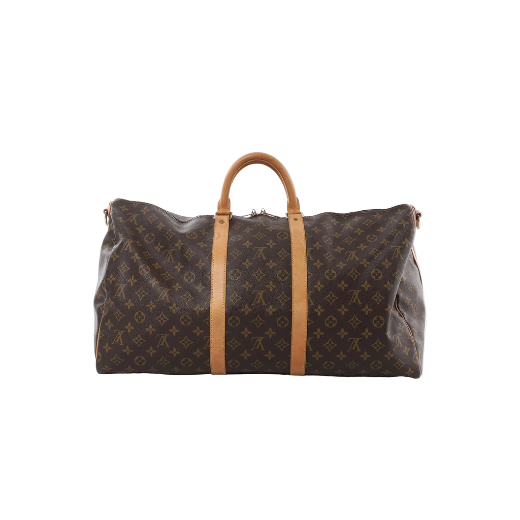 Louis Vuitton Monogram canvas Keepall 55 travel bag with tan leather handles and vertical leather straps on white background (shoulder strap not shown)