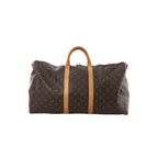 Louis Vuitton Monogram canvas Keepall 55 travel bag with tan leather handles and vertical leather straps on white background (shoulder strap not shown)