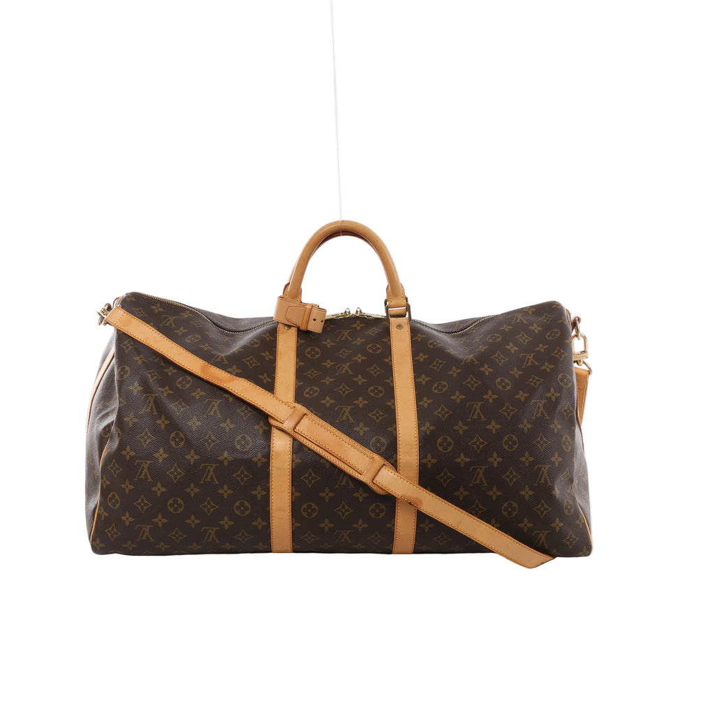 Brown Louis Vuitton Keepall Bandoulière 60 Monogram canvas travel bag with tan leather handles, shoulder strap, vertical trim and gold-tone zip hardware.