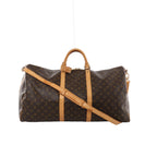 Brown Louis Vuitton Keepall Bandoulière 60 Monogram canvas travel bag with tan leather handles, shoulder strap, vertical trim and gold-tone zip hardware.