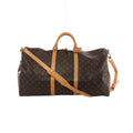 Brown Louis Vuitton Keepall Bandoulière 60 Monogram canvas travel bag with tan leather top handles, vertical trim, shoulder strap and gold-tone hardware.
