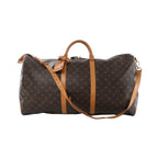 Louis Vuitton Keepall Bandoulière 60 monogram canvas travel bag in brown with tan vachetta leather trim, top handles, zip closure, luggage tag, and detachable shoulder strap.