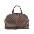 Louis Vuitton Kensington Bowling handbag in brown Damier Ebene coated canvas with dark leather top handles, gold-tone V detail, removable shoulder strap, and structured silhouette on a white background.
