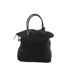 Louis Vuitton Lockit Vertical MM dark navy Monogram Désil shoulder bag with glossy black top handles, zip closure, and hanging padlock detail on a white background.