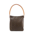 Louis Vuitton Looping GM shoulder bag in brown Monogram canvas with a curved tan vachetta leather loop handle, front view on white background.