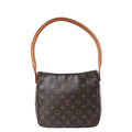 Louis Vuitton Looping MM brown Monogram shoulder bag with curved tan leather strap and zip-top closure.