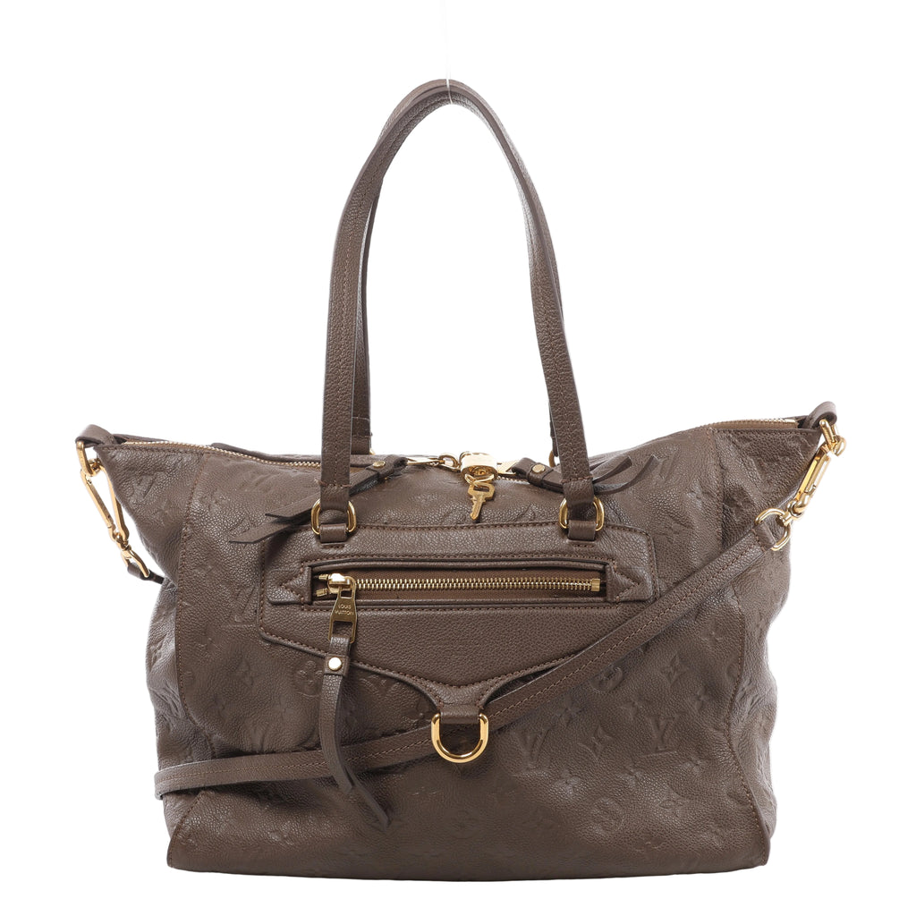 Front view of a brown Louis Vuitton Lumineuse PM bag with embossed Monogram leather, twin handles, a shoulder strap, front zip pocket and gold-tone hardware.