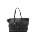 Louis Vuitton Lumineuse PM shoulder bag in navy Monogram Empreinte leather with gold-tone hardware, top zip closure, front zip pocket, and two shoulder straps on a white background.
