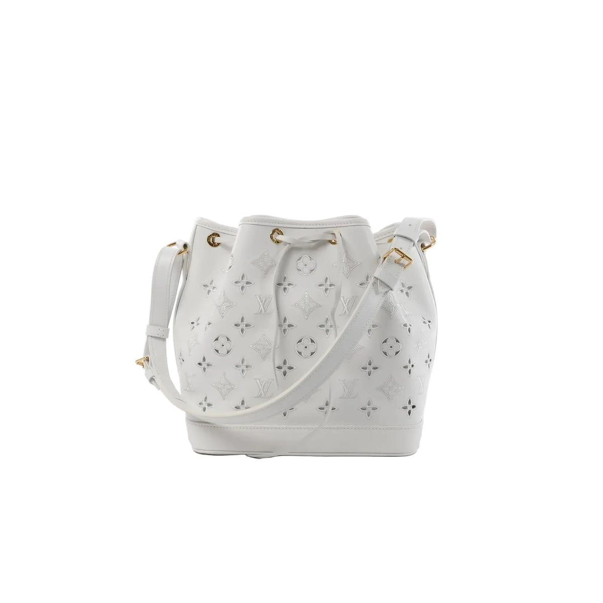White Louis Vuitton Petit Noé NM bucket bag with Monogram cutout pattern, drawstring closure, gold-tone grommets, and adjustable shoulder strap.