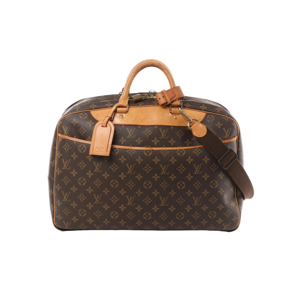 Louis Vuitton Monogram canvas travel bag with tan leather handles and trim, front pocket, luggage tag, top zip closure, and brown shoulder strap
