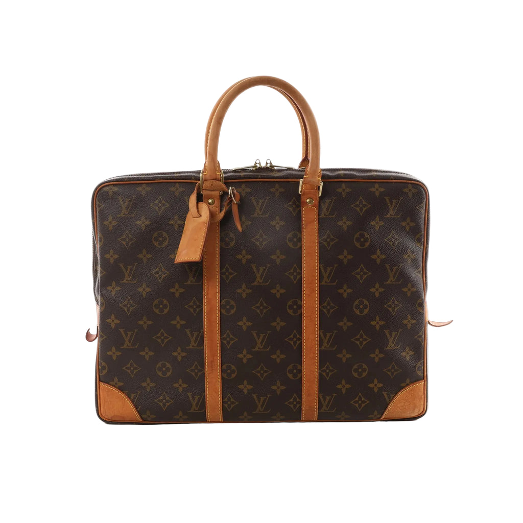 Louis Vuitton Porte Documents Voyage brown Monogram canvas briefcase bag with vachetta leather top handles, trim, and luggage tag on white background.