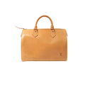 Light brown Louis Vuitton Speedy 30 Nomade leather handbag with double top handles, top zip closure, and embossed LV logo