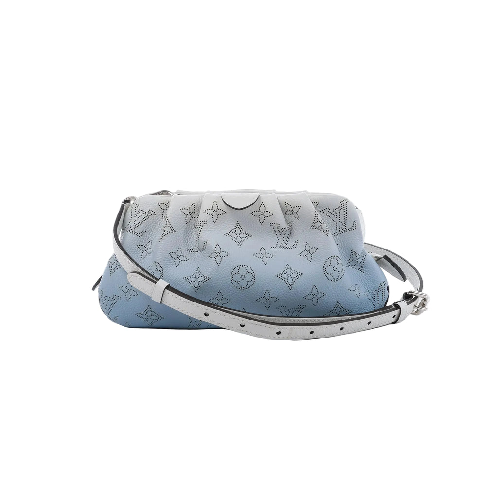 Louis Vuitton Scala Mini crossbody bag in pale blue and white grained leather with perforated Monogram motifs and an adjustable strap.