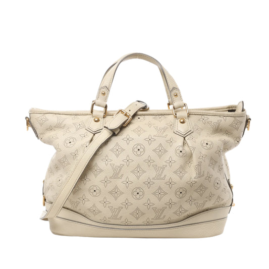 Front view of Louis Vuitton Monogram Mahina Stella PM Leather Handbag M93067 in beige perforated leather with signature LV monogram pattern, gold-tone hardware, double top handles, and adjustable shoulder strap, displayed against a white background.