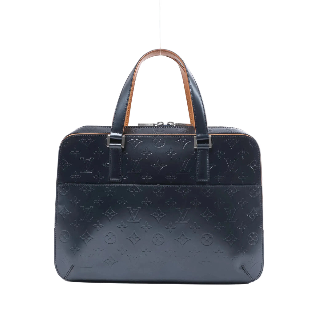 Front view of a navy blue Louis Vuitton Malden handbag in embossed Monogram Mat leather with dual handles, silver-tone hardware and a front pocket.