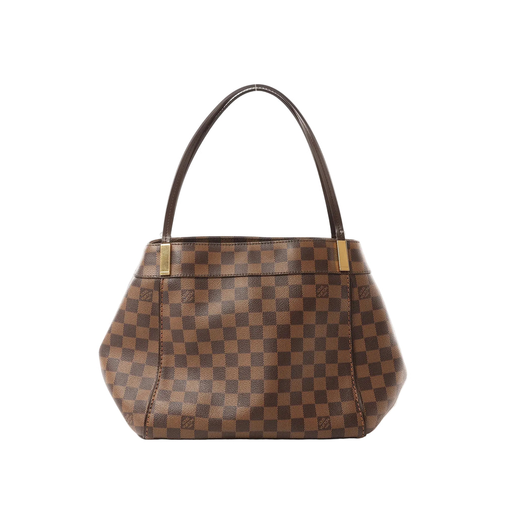 Louis Vuitton Marylebone PM shoulder bag in brown Damier Ebene check canvas with dark leather shoulder strap and gold-tone hardware, shown on a white background.