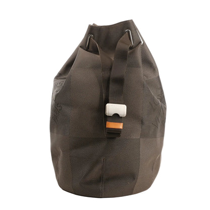 Louis Vuitton Matero PM shoulder bag in gray Damier Geant canvas with oversized check pattern, top drawstring closure, and adjustable web strap with silver-tone buckle.