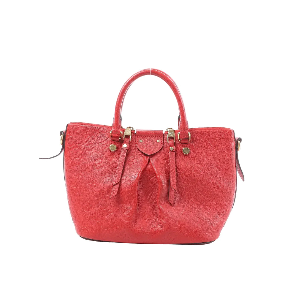 Red Louis Vuitton Mazarine PM Monogram Empreinte leather handbag with top handles, zip-top closure, and gold-tone hardware on a white background.