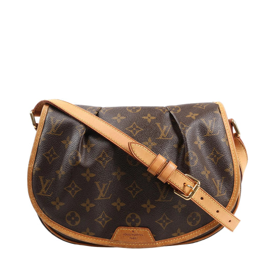 Louis Vuitton Ménilmontant PM Crossbody Bag M40474 in brown Monogram canvas with natural vachetta leather trim, adjustable leather shoulder strap, and curved flap design, displayed against a white background.