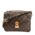 Louis Vuitton Pochette Métis MM crossbody bag M44875 in brown Monogram canvas, featuring the signature LV pattern, front flap with gold-tone S-lock closure, top handle, and adjustable leather strap with gold hardware.