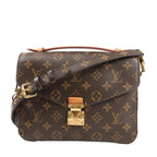 Louis Vuitton Pochette Métis MM crossbody bag M44875 in brown Monogram canvas, featuring the signature LV pattern, front flap with gold-tone S-lock closure, top handle, and adjustable leather strap with gold hardware.