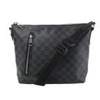 Louis Vuitton Mick PM bag in black and grey Damier Graphite canvas with a vertical front zip pocket and adjustable black strap draped across the front.
