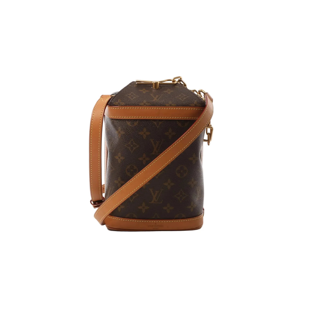 Louis Vuitton Milk Box Monogram canvas crossbody bag in brown with tan leather trim, top handle, and long leather shoulder strap